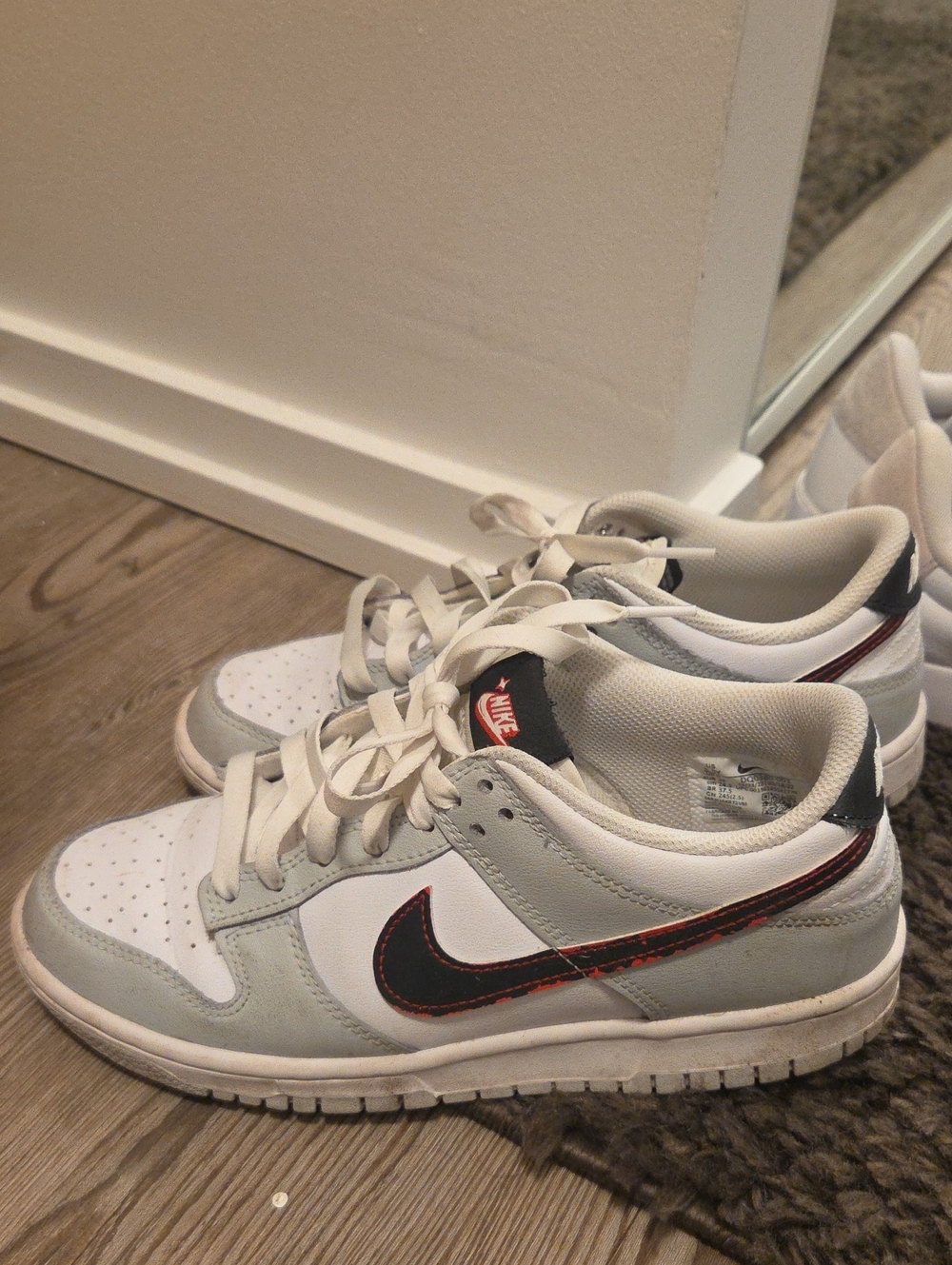 Nike Dunk Low Sneakers in White, Light Gray, Black & Red Accent